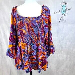 Beautiful vibrant colors bell sleeve smocked peplum top size 1X NWOT